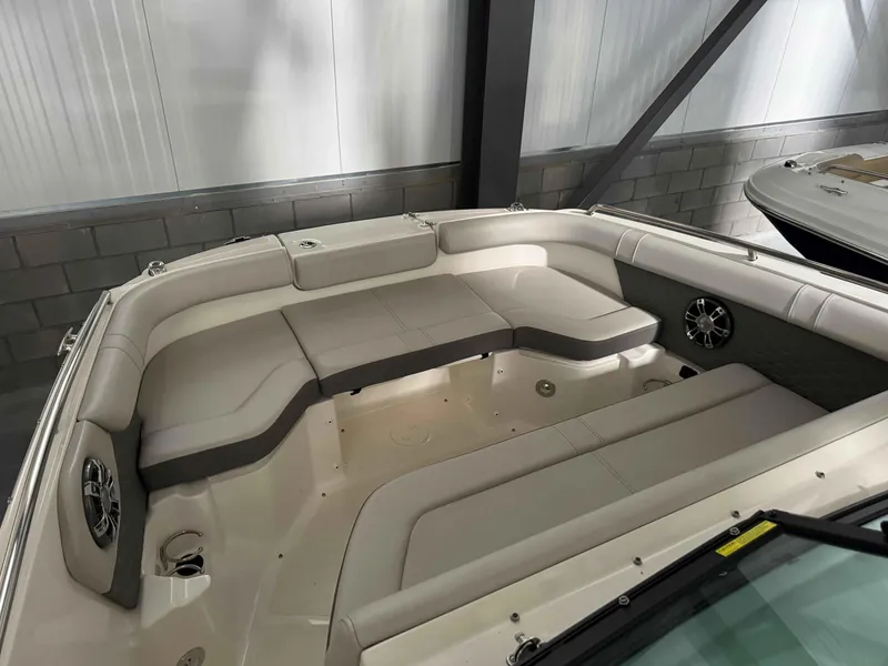 Slide: The Image of 2023 Sea Ray 250SDX boat interior with spacious seating and modern design. - 9