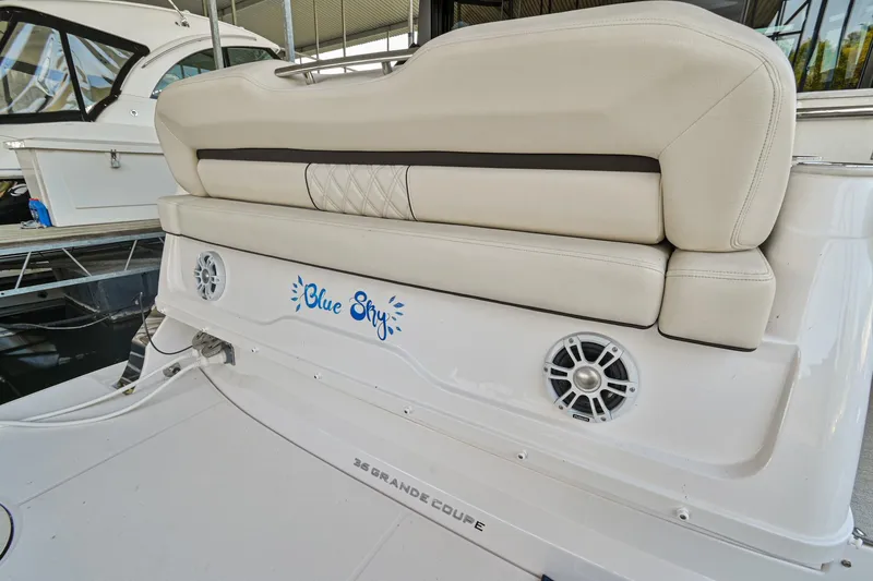 Slide: The Image of 2021 Regal 36 Grande Coupe boat with "Blue Sky" name and beige seating. - 11