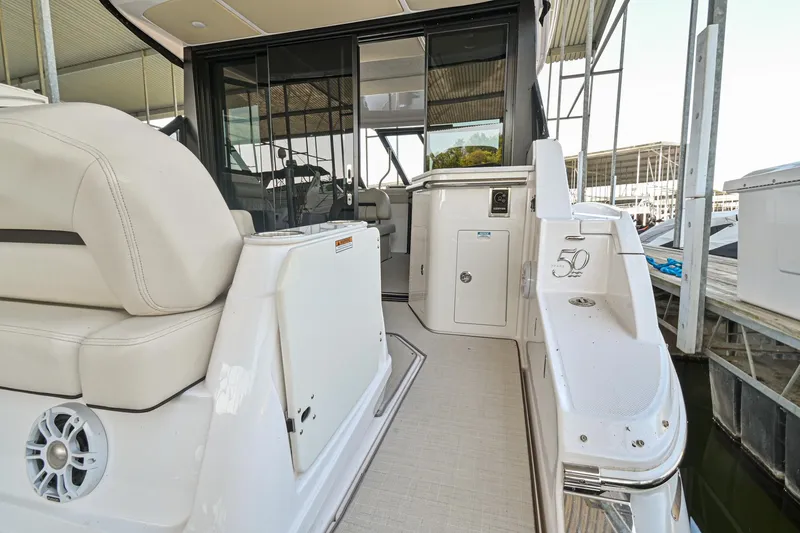 Slide: The Image of 2021 Regal 36 Grande Coupe yacht interior with sleek seating and modern design. - 13