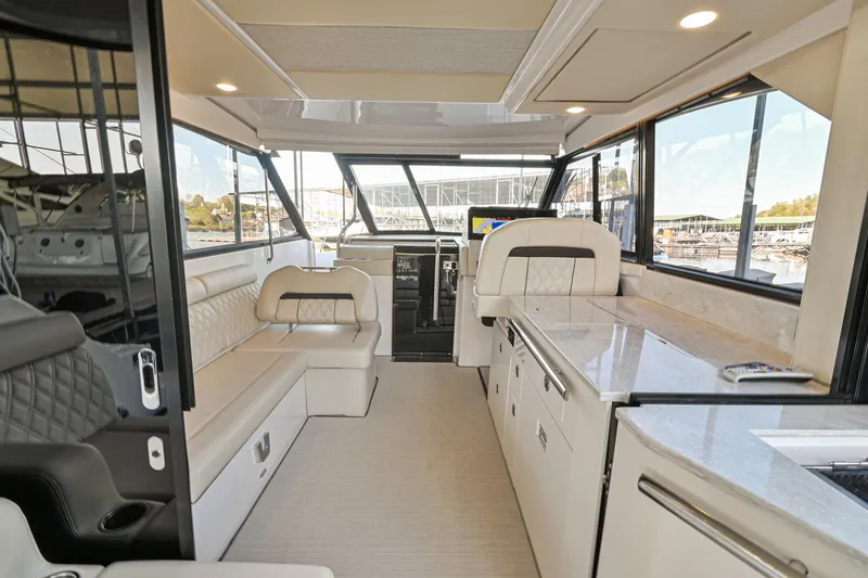 Slide: The Image of Interior of 2021 Regal 36 Grande Coupe yacht with luxurious seating and modern design. - 21