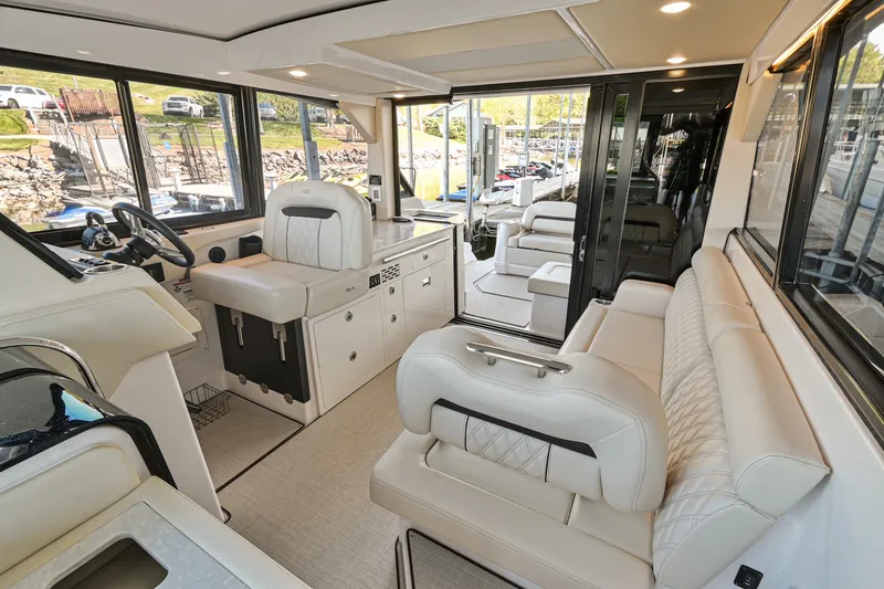 Slide: The Image of Luxurious interior of 2021 Regal 36 Grande Coupe yacht with plush seating. - 22