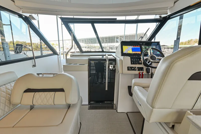 Slide: The Image of Interior of 2021 Regal 36 Grande Coupe yacht with modern helm and seating. - 30