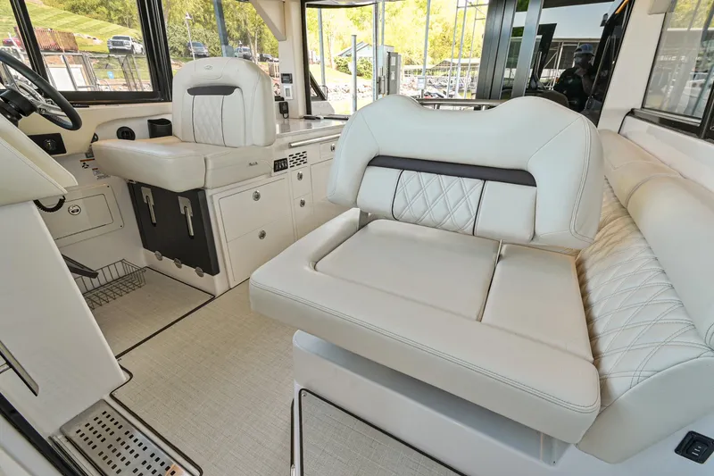 Slide: The Image of Luxurious interior of 2021 Regal 36 Grande Coupe yacht with plush seating. - 32