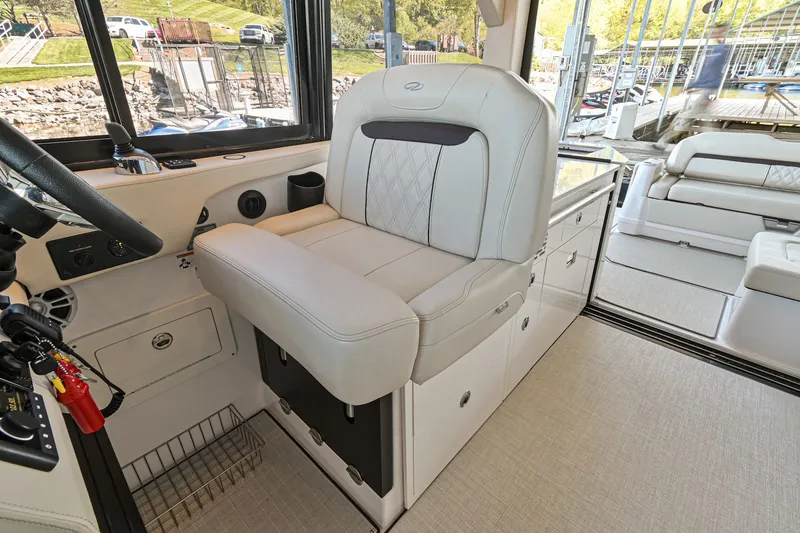 Slide: The Image of 2021 Regal 36 Grande Coupe interior with luxurious seating and modern design. - 34