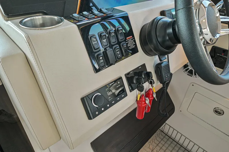 Slide: The Image of 2021 Regal 36 Grande Coupe dashboard with controls and steering wheel. - 37