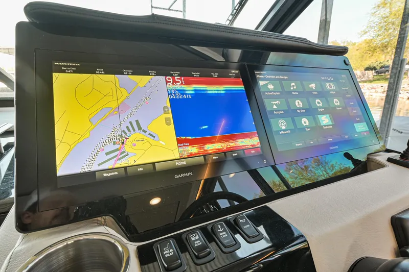 Slide: The Image of 2021 Regal 36 Grande Coupe dashboard with advanced navigation displays. - 38
