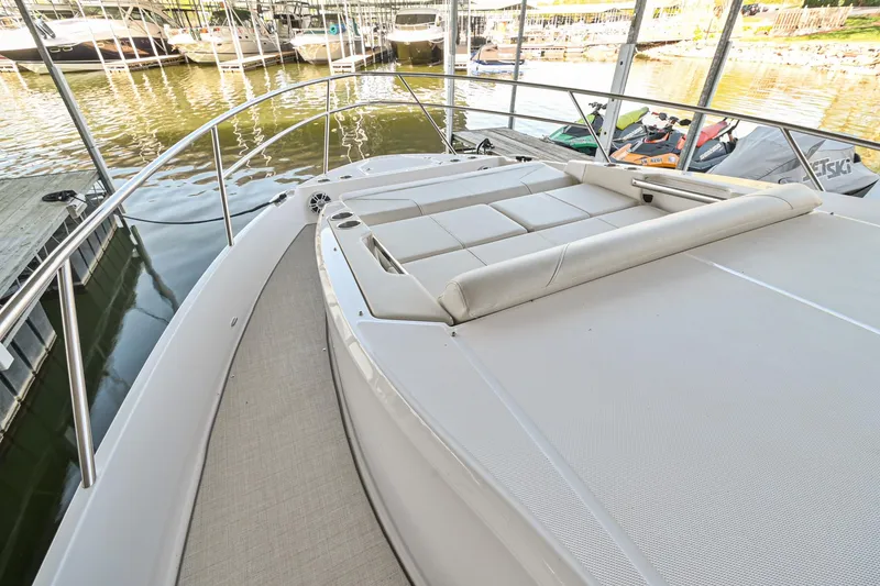 Slide: The Image of 2021 Regal 36 Grande Coupe yacht with spacious deck and luxurious seating. - 43