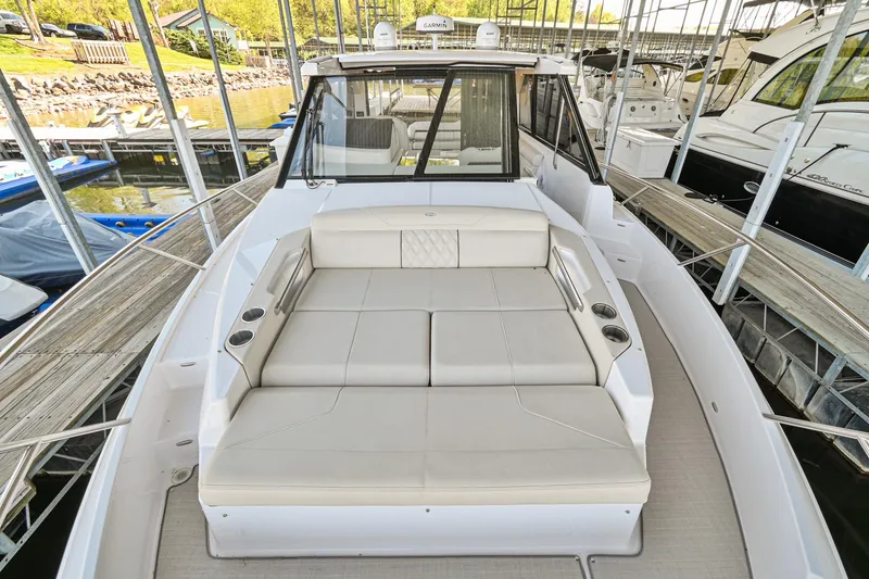 Slide: The Image of 2021 Regal 36 Grande Coupe luxury yacht with spacious deck seating. - 44