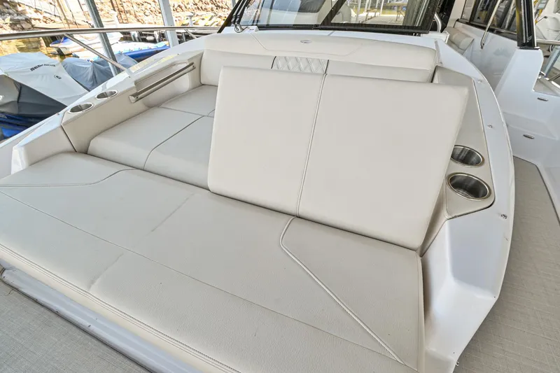 Slide: The Image of 2021 Regal 36 Grande Coupe boat with spacious, luxurious seating area. - 46