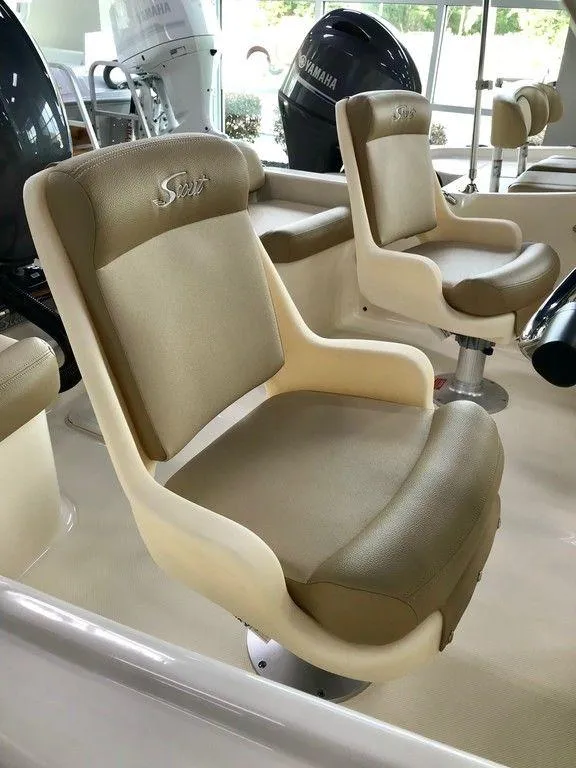 Slide: The Image of 2025 Scout 175 Sport Dorado boat seats, beige leather, modern design. - 3
