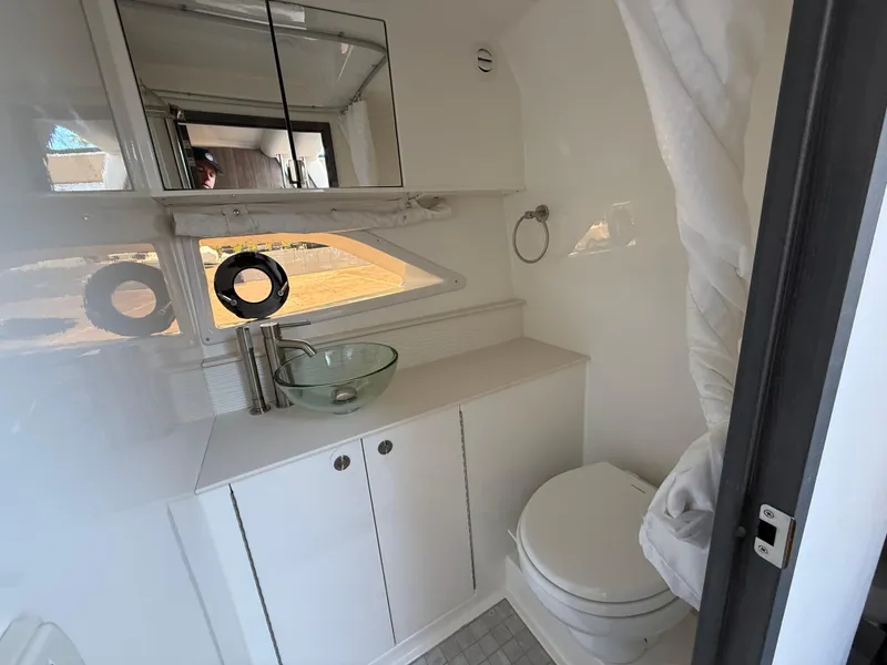 Slide: The Image of 2025 Sea Ray Sundancer 320 OB bathroom with modern fixtures and sleek design. - 22
