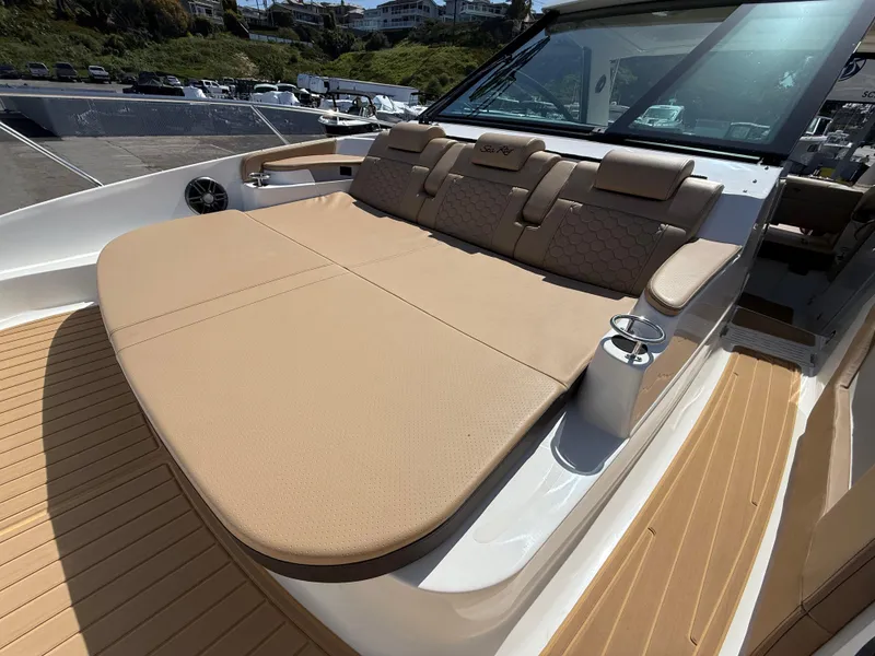 Slide: The Image of 2025 Sea Ray Sundancer 320 OB with spacious sunbathing deck and luxurious seating. - 25