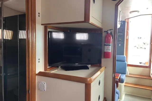 Slide: The Image of Interior of 2003 Albin 32 + 2 Command Bridge with TV and seating area. - 10