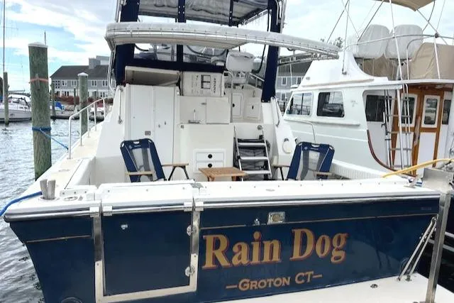 Slide: The Image of 2003 Albin 32 + 2 Command Bridge boat named "Rain Dog" docked in Groton, CT. - 3