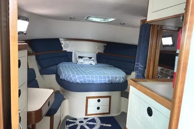 Slide: The Image of 2003 Albin 32 + 2 Command Bridge cabin with cozy bed and nautical decor. - 6