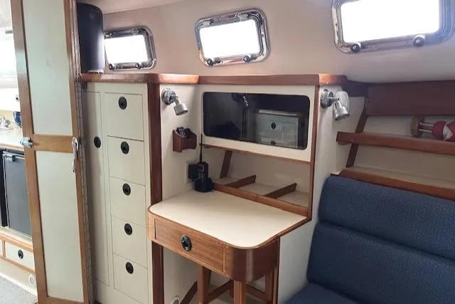 Slide: The Image of Interior of 2003 Albin 32 + 2 Command Bridge with desk and storage. - 9