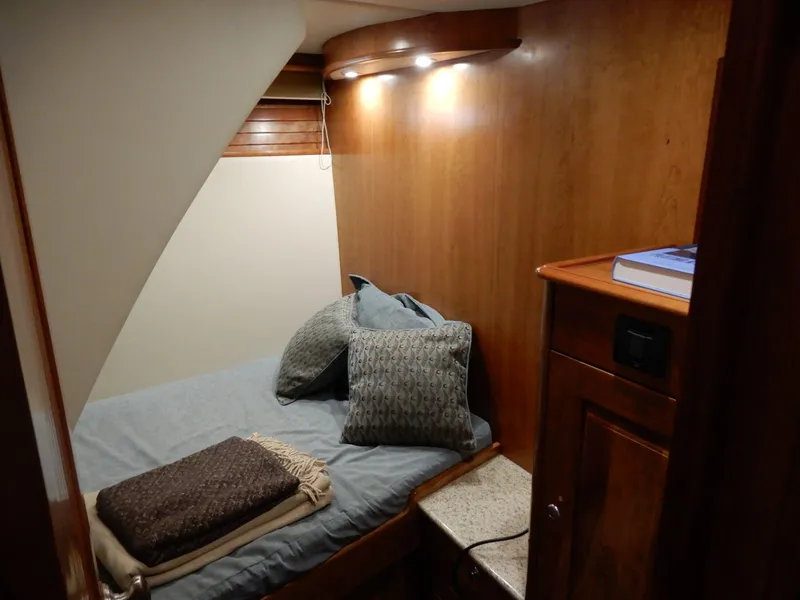 Slide: The Image of Cozy cabin interior of 2008 Bracewell Pacesetter 540 with wooden paneling and soft bedding. - 11
