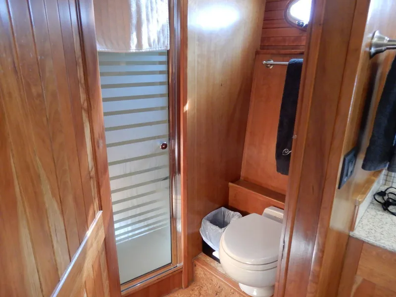 Slide: The Image of Bathroom interior of 2008 Bracewell Pacesetter 540 yacht with wooden paneling and shower. - 14
