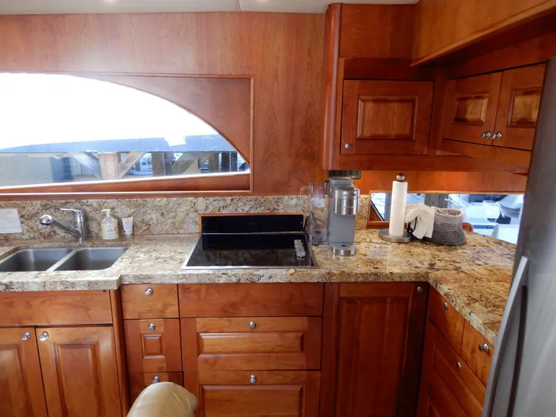 Slide: The Image of Luxurious kitchen interior of 2008 Bracewell Pacesetter 540 yacht with wooden cabinets and granite countertops. - 3