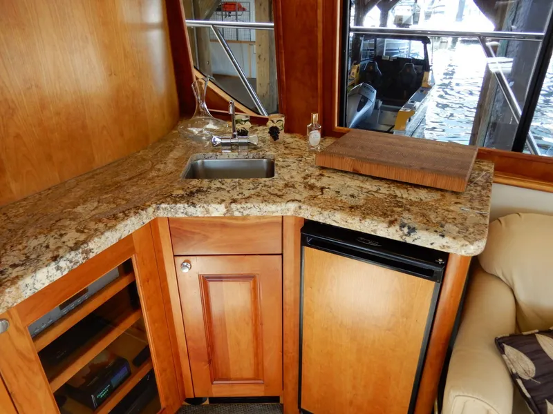 Slide: The Image of Luxurious kitchen area in 2008 Bracewell Pacesetter 540 yacht with granite countertop and mini fridge. - 6