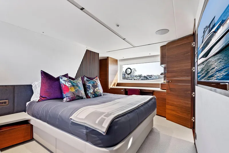 Slide: The Image of Luxurious bedroom interior of 2023 Princess Y72 yacht with modern design and scenic window view. - 38