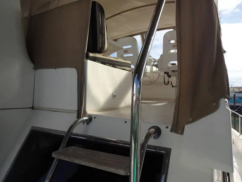 Slide: The Image of 2006 Ocean Alexander 48 Classico yacht docked at marina. - 12