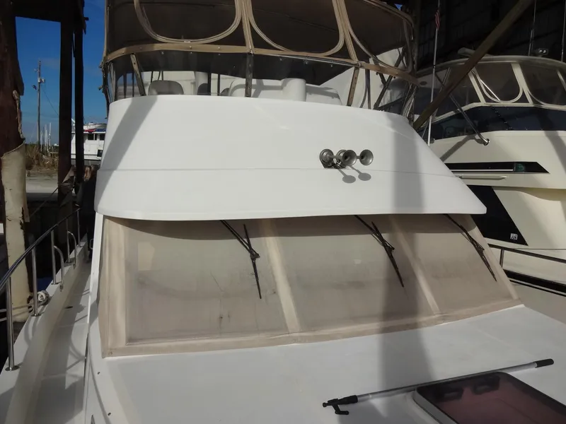 Slide: The Image of 2006 Ocean Alexander 48 Classico yacht on calm water. - 2