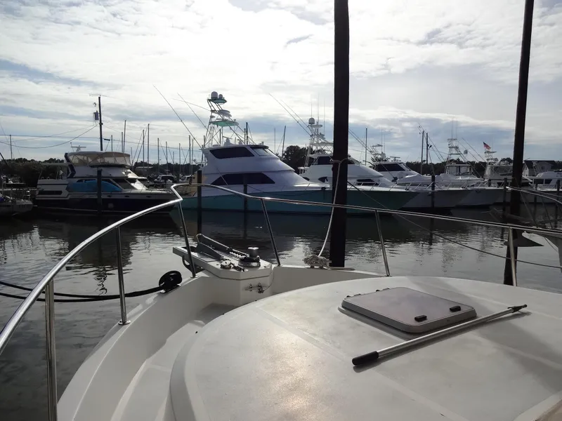 Slide: The Image of 2006 Ocean Alexander 48 Classico yacht on calm water. - 4