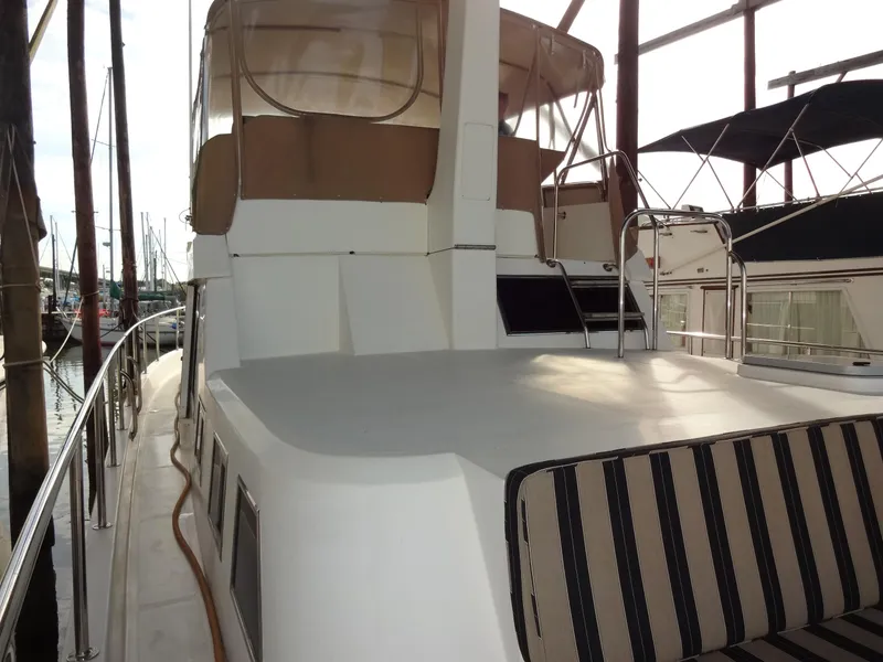 Slide: The Image of 2006 Ocean Alexander 48 Classico yacht docked in marina. - 7