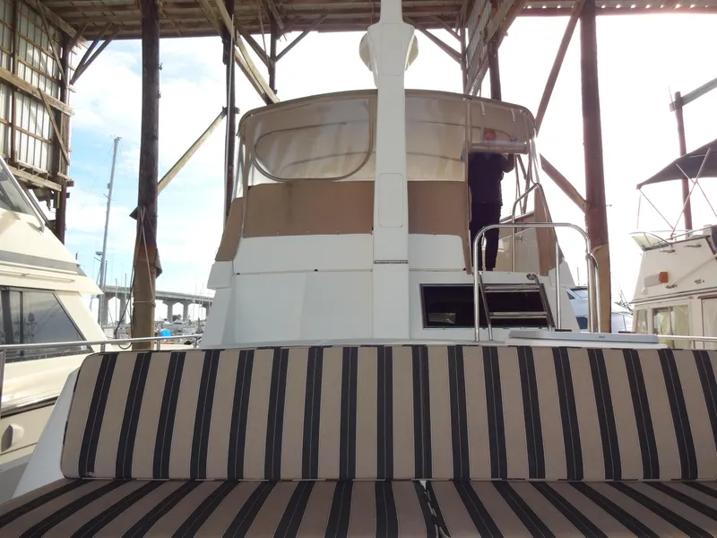 Slide: The Image of 2006 Ocean Alexander 48 Classico yacht docked at marina. - 8