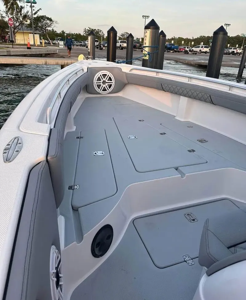 Slide: The Image of 2007 Donzi 35 ZF Open boat interior at a marina dock. - 12