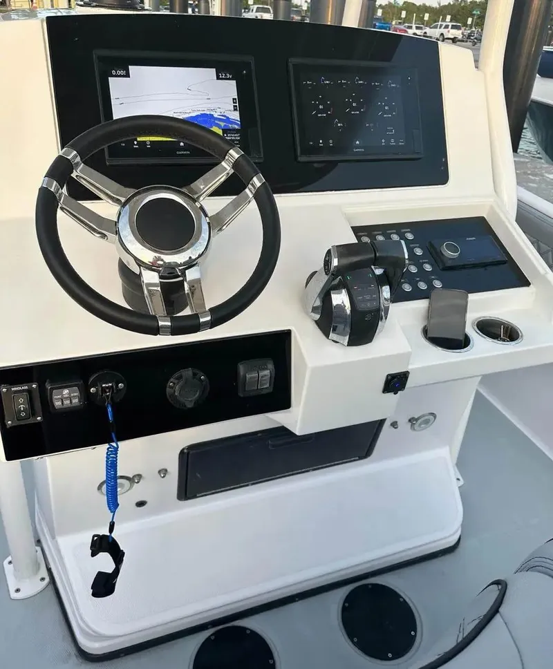 Slide: The Image of 2007 Donzi 35 ZF Open boat helm with modern controls and navigation screens. - 5