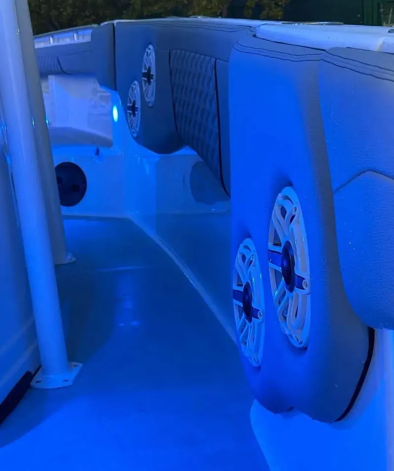 Slide: The Image of 2007 Donzi 35 ZF Open boat interior with blue LED lighting and speakers. - 6