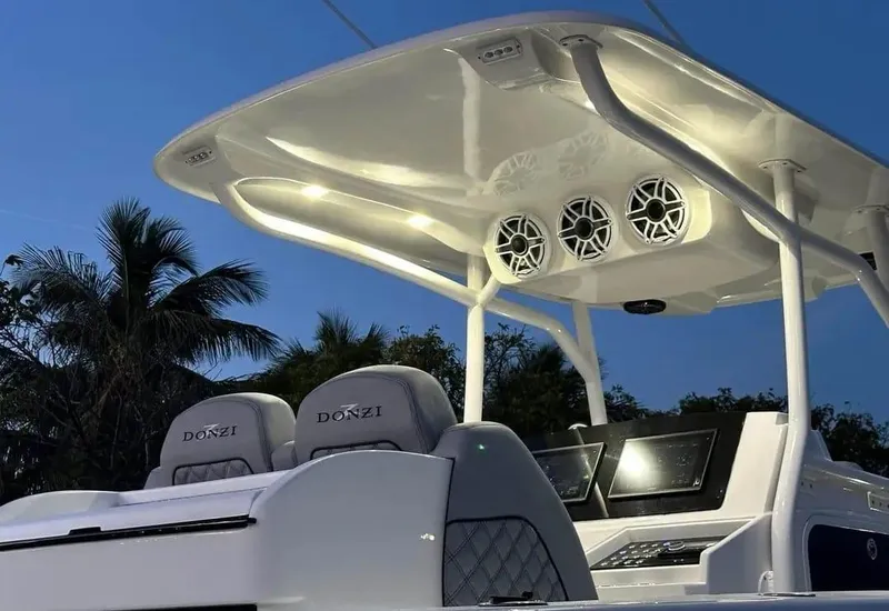 Slide: The Image of 2007 Donzi 35 ZF Open boat interior with illuminated canopy and modern controls. - 9