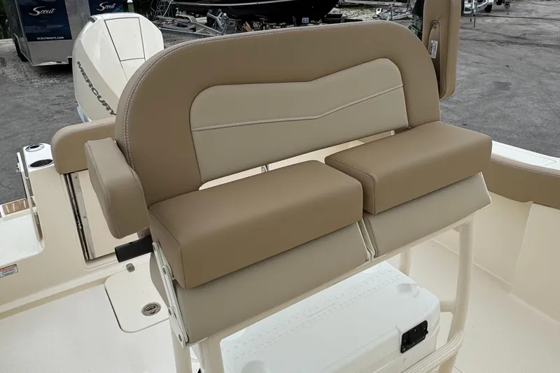 Slide: The Image of 2025 Scout 240 XSF boat seating with beige and cream cushions. - 5