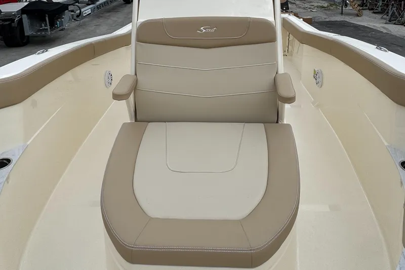 Slide: The Image of 2025 Scout 240 XSF boat with beige seating and armrests. - 7