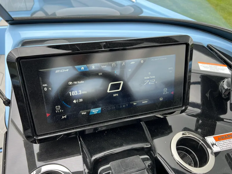 Slide: The Image of Dashboard of 2025 Yamaha Boats 255XD, featuring touchscreen display with speedometer and radio controls. - 12