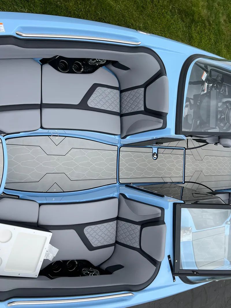 Slide: The Image of 2025 Yamaha Boats 255XD interior, featuring sleek seating and modern design. - 15