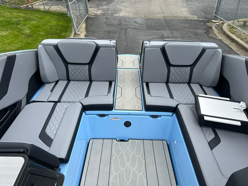 Slide: The Image of 2025 Yamaha Boats 255XD interior with gray seating and modern design. - 18
