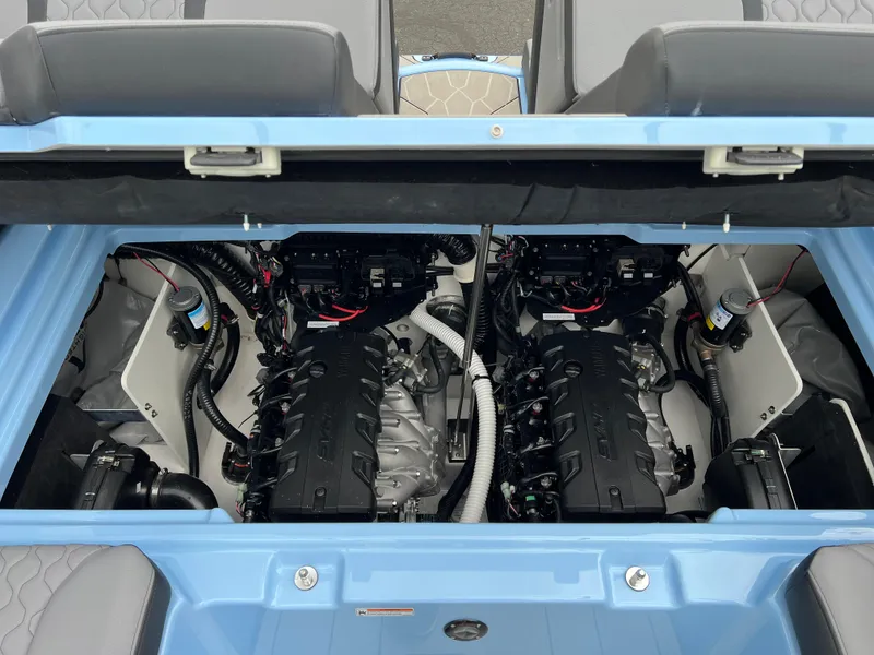 Slide: The Image of 2025 Yamaha Boats 255XD engine compartment with dual engines, showcasing advanced marine technology. - 19