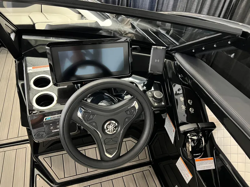Slide: The Image of 2025 Yamaha Boats 275 SD dashboard with steering wheel and touchscreen display. - 10