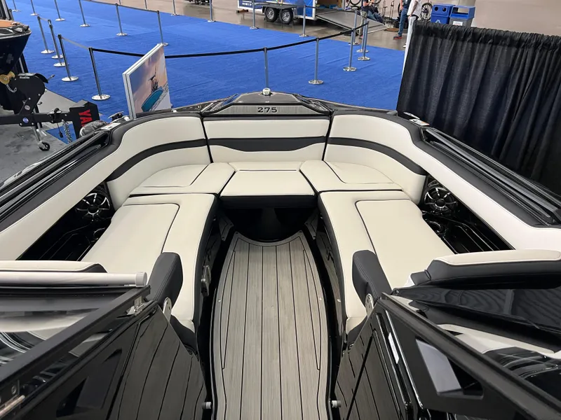 Slide: The Image of 2025 Yamaha Boats 275 SD interior with sleek seating and modern design. - 13