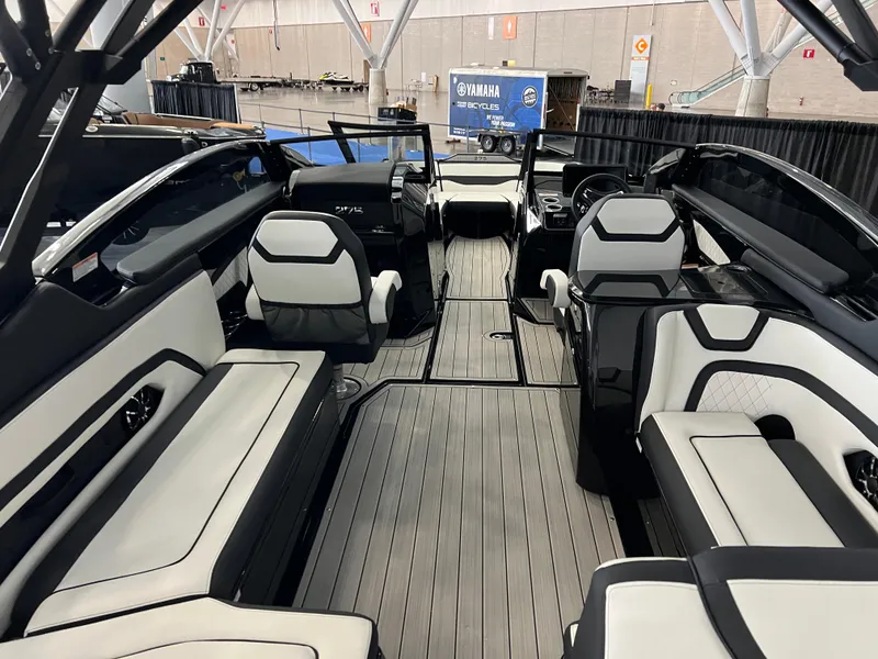 Slide: The Image of 2025 Yamaha Boats 275 SD interior with sleek seating and modern design. - 7