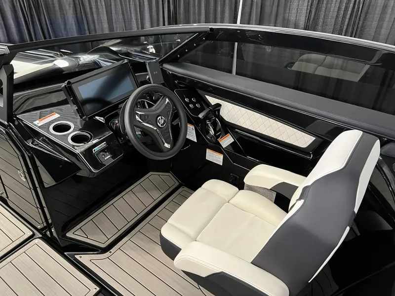 Slide: The Image of 2025 Yamaha Boats 275 SD cockpit with modern steering and seating. - 9