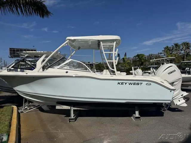 Slide: The Image of 2025 Key West 239 DFS boat displayed outdoors on a sunny day. - 1