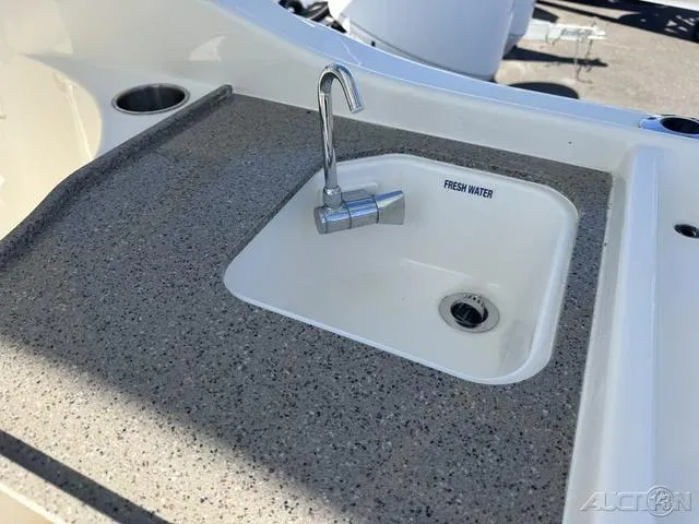 Slide: The Image of 2025 Key West 239 DFS boat seat with white upholstery and quilted design. - 13