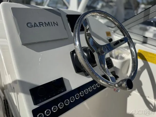 Slide: The Image of 2025 Key West 239 DFS boat interior, featuring sleek white design and modern controls. - 17