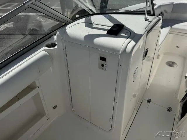 Slide: The Image of 2025 Key West 239 DFS boat interior with white seating and speakers. - 18