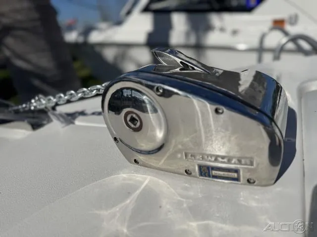 Slide: The Image of 2025 Key West 239 DFS boat interior with white cushioned seating and cup holders. - 20