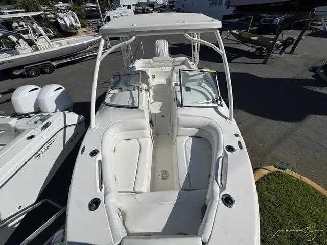 Slide: The Image of 2025 Key West 239 DFS boat interior with white seating and spacious layout. - 23